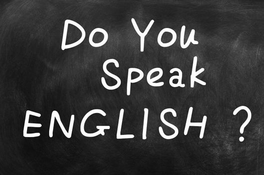 Do you speak English written with chalk on a blackboard