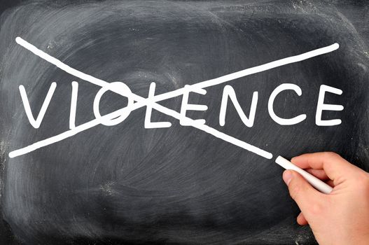 No violence concept on a blackboard, crossing out by chalk