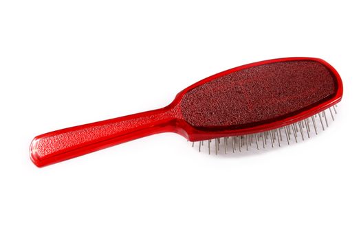 red hair brush on a white background