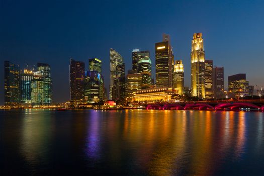 Singapore skyline and Marina Bay in evening