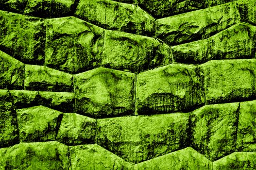 Green, rough old stone wall