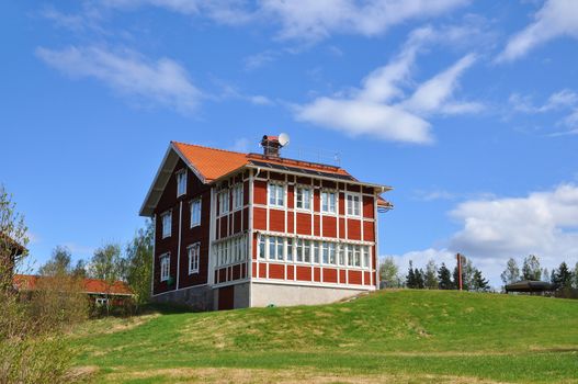 Red house in the countryside, typical swedish architecture.
