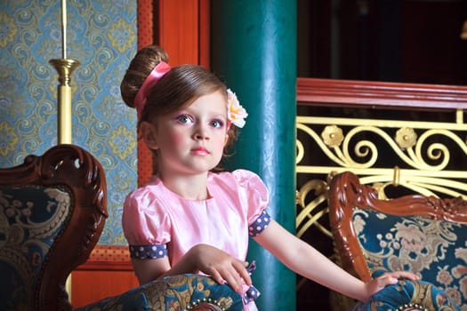 Portrait of girl in pink, close-up.