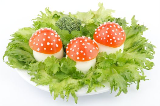 Fly mushroom formed from boiled egg, cover with the tomato mayonnaise. Funny food for children or party.