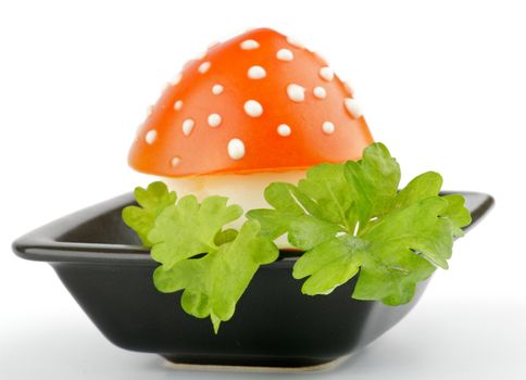 Fly mushroom formed from boiled egg, cover with the tomato mayonnaise. Funny food for children or party.