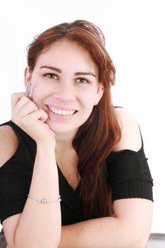 Portrait of a pretty young businesswoman at the office desk holding a pen against white background