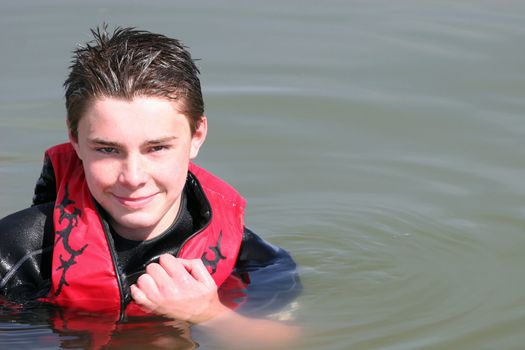 Young boy playing in the water