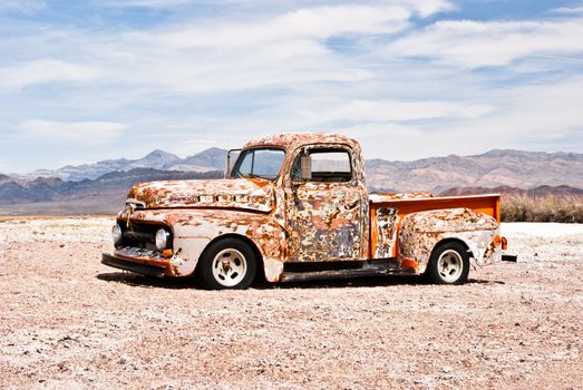Abandoned vintage truck suffers in the hot desert