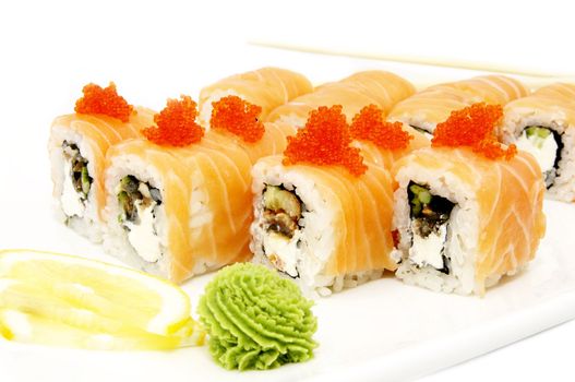 Sushi on a plate with caviar and salmon on a white background