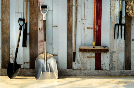 Gardening tool Hang on a blue old wood wall