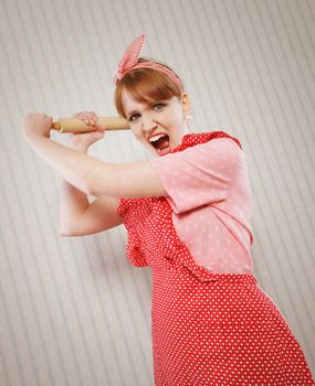 Angry housewife with rolling pin