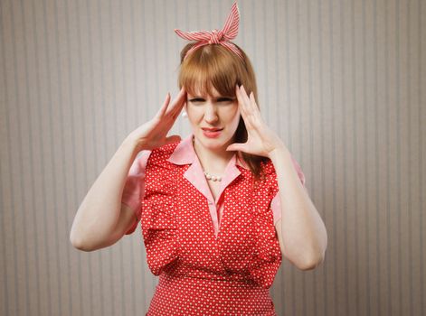 Retro housewife suffering headache