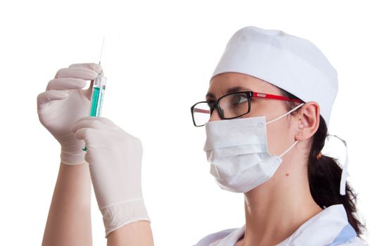 Woman doctor in mask with syringe over white