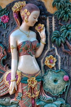 Thai style decorated , Thai's ancient woman standing in front of a tree.