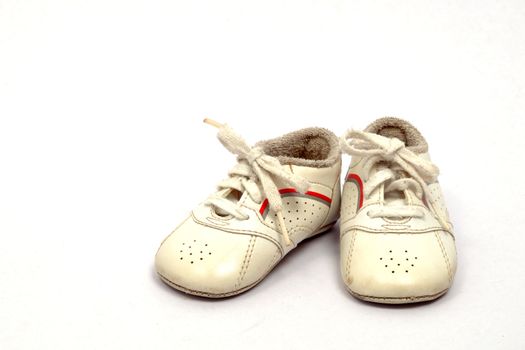 Baby first sports shoes on white background