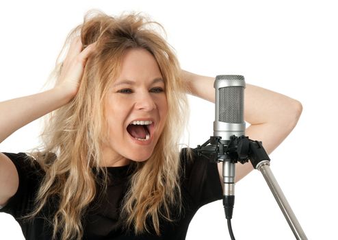 Female rock singer screaming to the microphone. Isolated on white background.