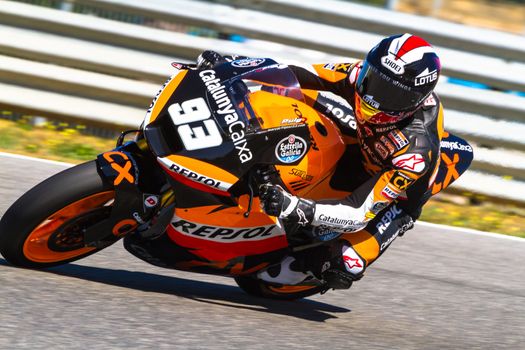 JEREZ DE LA FRONTERA, SPAIN - MAR 19: Moto2 motorcyclist Marc Marquez takes a curve in the MotoGP Official Trainnig on March 19, 2012 in Jerez de la Frontera, Spain
