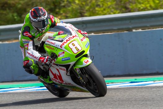 JEREZ DE LA FRONTERA, SPAIN - MAR 25: MotoGP motorcyclist Hector Barbera takes a curve in the MotoGP Official Trainnig on March 25, 2012 in Jerez de la Frontera, Spain