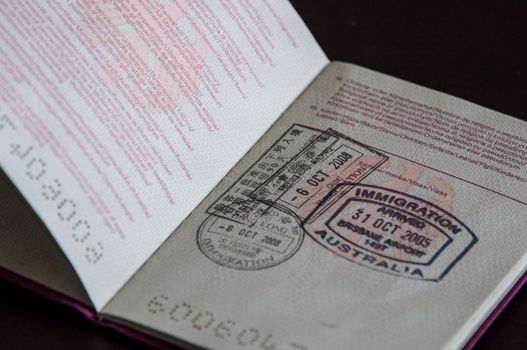 german passport with immigration stamps of HongKong and Australia, concept of travel