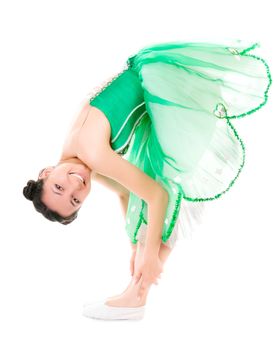 Exercising cheerful ballerina in green dress isolated on white background