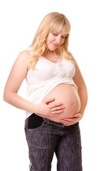 Pregnant woman caressing her belly isolated on white