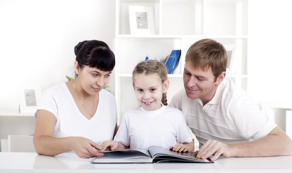 Family reading a book together, a family vacation