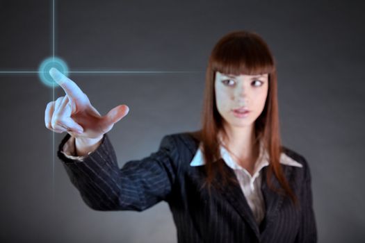 Business woman pointing on sensor screen, high technology concept 