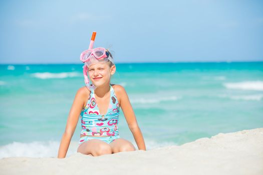 Portrait of a cute girl wearing a mask for diving background of the sea