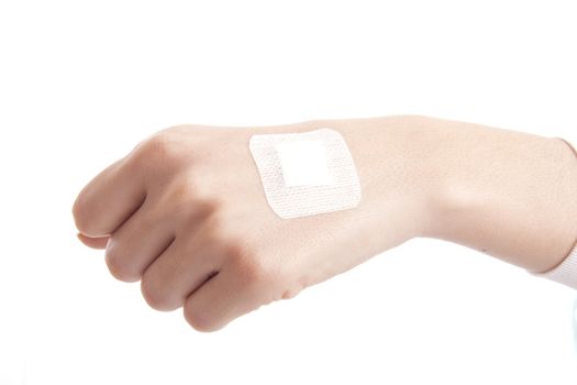 hand with Adhesive Bandage isolated on white