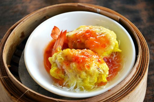 Steamed shrimp dumplings dim sum , cellophane noodle and delicious sauce