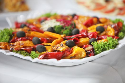 Platter of colourful cooked cold vegetables on a buffet table at a catered event