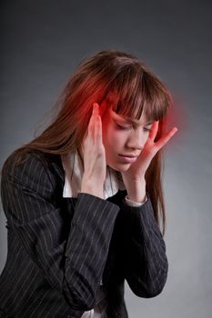 Business woman with headache, studio shot 