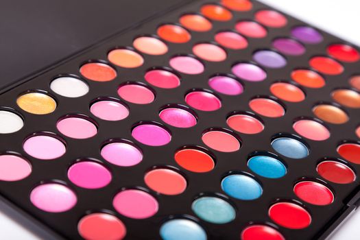 Close-up shot of lip gloss palette, soft focus 