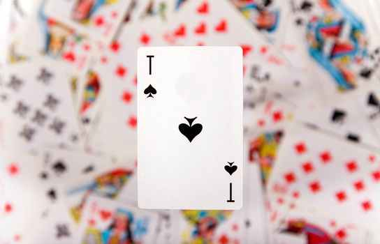 Close-up up of an ace over blurred card background 