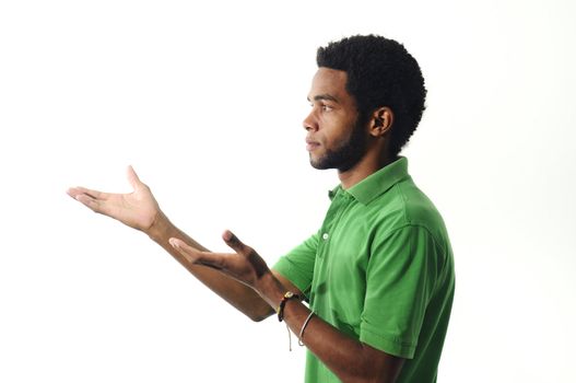 Portrait of young african american man gesturing over white background