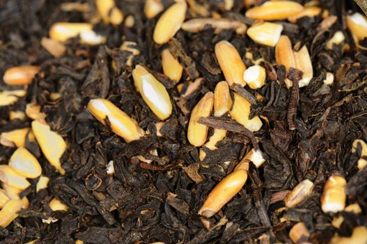 Macro shot of organic black tea leaves with rice