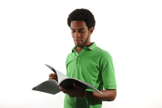 Portrait of young african american man reading a magazine isolated on white