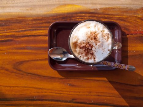 Top view of cup of coffee latte with whipped cream. 