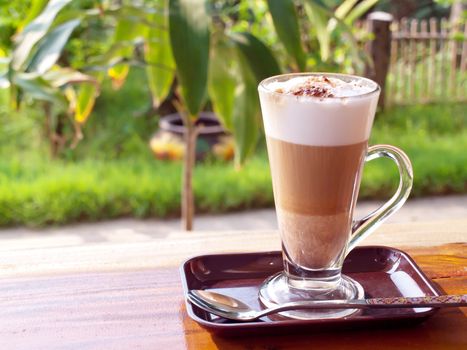 Coffee break with coffee latte in garden