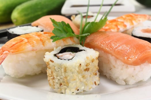 variety of sushi with parsley and chives