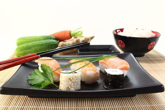 variety of sushi with parsley and chives