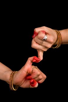 Woman hand showing Kilaka hasta of indian classic dance Bharata Natyam