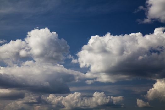 Blue sky with white cumulus clouds 