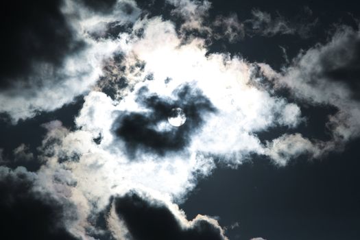 Moon and clouds on the dark blue sky