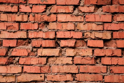 Grungy cracked old red brick texture, natural light  