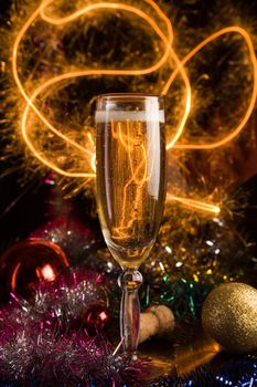 New Year card with champagne glass on holiday background