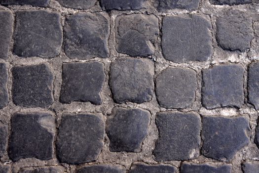 A close-up of a cobblestone road from Rome, Italy.