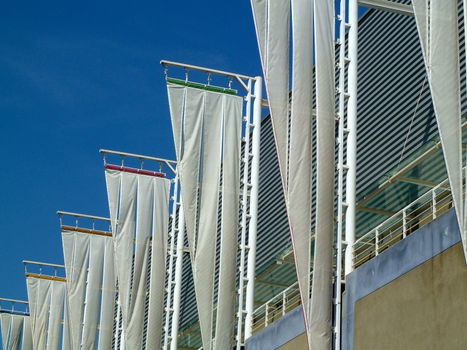 white triangular flags hanging from poles