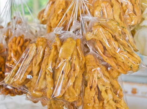Bread sticks with spices in transparent bag