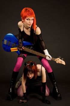  Rock girls with guitar isolated in studio